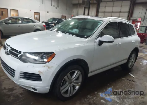 2014 Volkswagen Touareg 3.6L Executive z USA, uszkodzony, nr VIN WVGEF9BP7ED010507